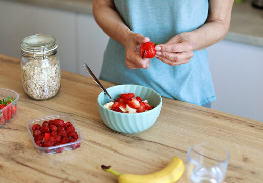 kitchen food woman healthy morning mature breakfast active fitness diet home healthy eating senior adult healthy lifestyle fruit sport fit health eating preparation nutrition female