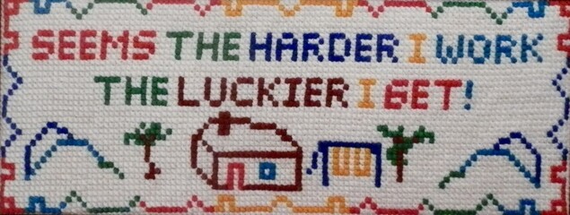 Fototapeta premium Needlepoint depiction of the tried and true saying, 