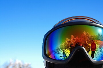 Ski mask with reflection of the winter mountain landscape