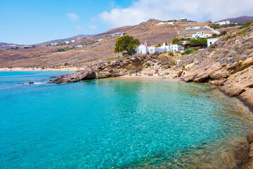 Paralia Agios Sostis wild and free beach in the north of Mykonos, Greece. Pristine bay with blue sea and crystal water, famous for naturism and Kiki's Tavern, peaceful and quiet.