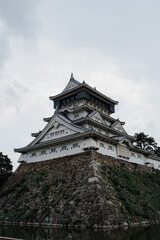 Traditional Japanese Castle Against Cloudy Sky