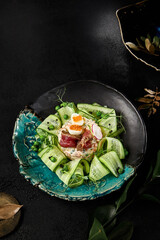 Elegant Presentation of Olivier Salad with Roast Beef and Fresh Cucumbers on Artistic Plate