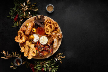 Assorted Beer Snacks Platter with Toasts, Sausages, Fried Calamari, Onion Rings, and Buffalo Wings...