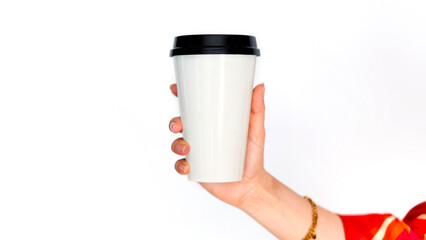 hand holding a cup of coffee