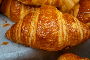 Breakfast in France, fresh baked butter croissants in artisanal bakery in Paris, France