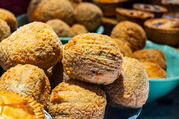 Traditional street food in UK, stuffed fried Scotch eggs with breadcrumbs close up