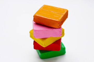 Colorful plasticine clay on white background.