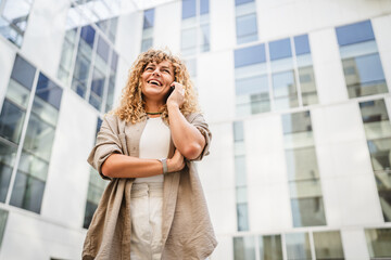 Adult woman take a break from work and talk on mobile phone