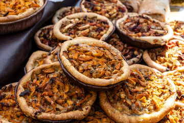Tasty vegetarian food, french quiche savoury tart with pumpkin, onion and cheddar cheese and mushrooms