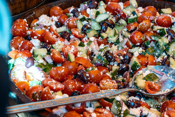 Pickled and marinated olives, artichokes, vegetables on farmers market, tasty tapas