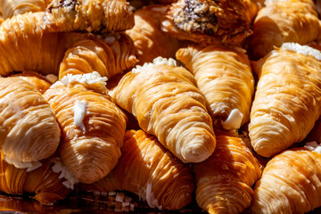 Naples sfogliatella, shell-shaped layered pastry, with sweet custard-like filling made with semolina, ricotta, and candied citrus fruit.
