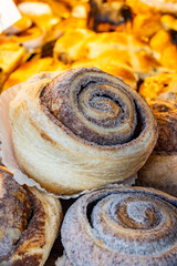 Fresh baked american chinnamon rolls buns on food market