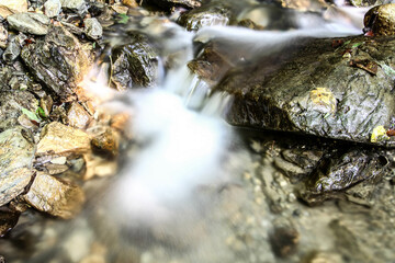 A beautiful mountain stream with large stones. HDR Image (High Dynamic Range).