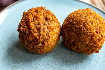 Traditional street food in UK, stuffed fried Scotch eggs with breadcrumbs close up