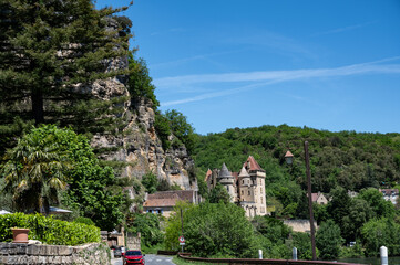 Driving along Dordogne river near   .La Roque-Gageac village located in Dordogne department in southwestern France