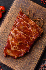 Delicious juicy grilled ribs baked on the grill with salt, spices and herbs