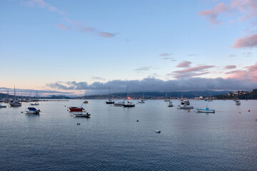 Sunset in Baiona Bay with its small boats in Pontevedra, Galicia, Spain © Uvamenfoto