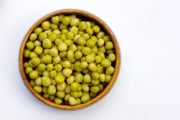 Canned green peas on white background.