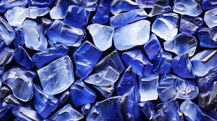 Fototapeta premium A Sea of Blue: Shimmering Sea Glass Fragments Glisten Under the Summer Sun