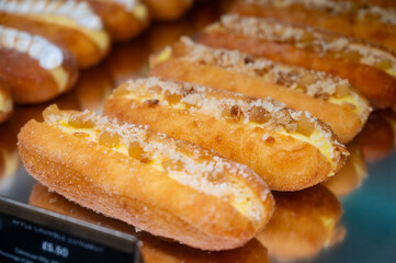 Various sweet cakes eclairs, meringue with cream