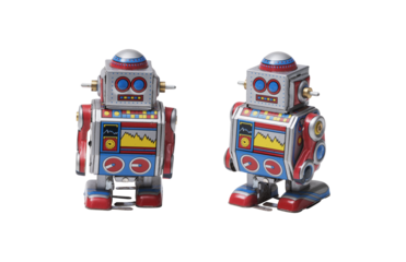 Funny cute tin toy robots on white background