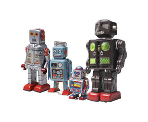 Fototapeta premium Funny cute tin toy robots on white background