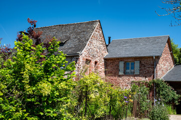 Collonges-la-Rouge village, one of the most beautiful villages in France with houses made from red...