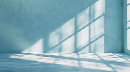 Obraz premium Minimal abstract light blue background for product presentation. Shadow and light from windows on plaster wall.