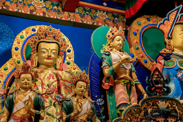 Buddhist temple interior featuring ornate decorations, statues of buddha, and traditional architecture. Serene atmosphere with intricate details, golden accents, religious and cultural artifacts Nepal