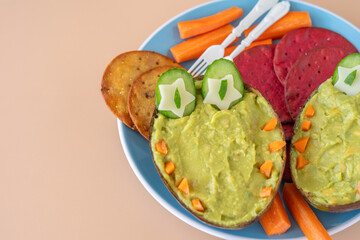 Tasty and healthy snack for kids including avocado cream, vegetable cookies.