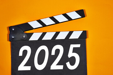 happy new year 2025 concept on clapper board of video cinema in studio. Movie production clapper...
