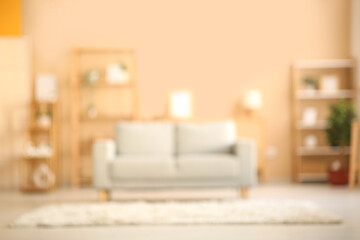 Blurred interior of living room with sofa