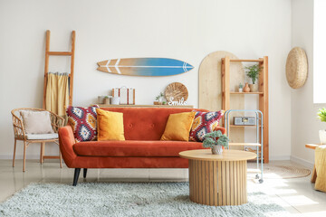 Interior of modern stylish living room with surfboard hanging on wall