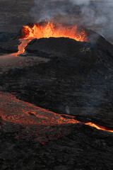 Volcanic eruption. Lava flowing from the crater.