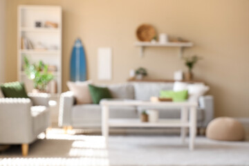 Fototapeta premium Interior of modern stylish room with surfboard and sofas