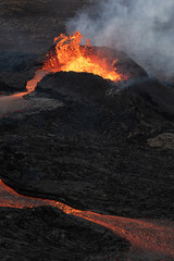 Volcanic eruption. Flowing hot lava from the crater. apocalyptic landscape
