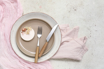 Stylish table setting with beautiful flowers on white background