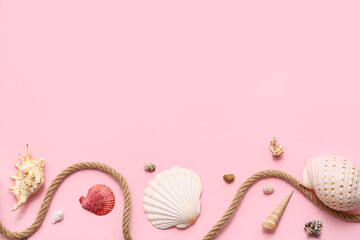 Beautiful seashells and rope on pink background. Summer concept