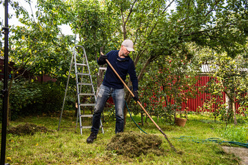 Midle age men working in the privat farmyard