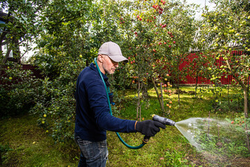 Midle age men working in the privat farmyard