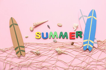 Surfboards and seashells on pink background. Summer concept