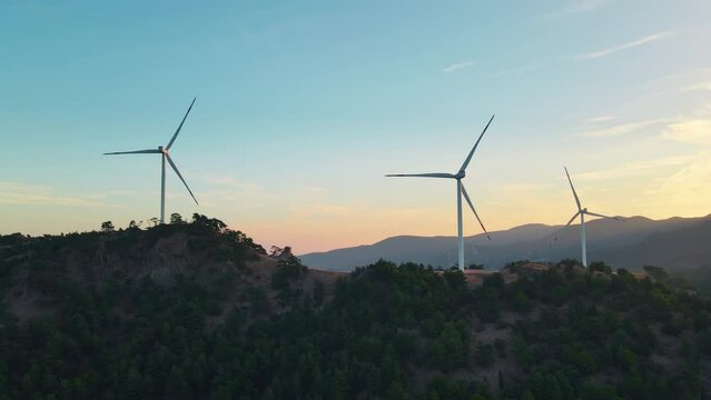 Wind turbines in mountain landscape, energy transition to reducing the carbon footprint and supporting ecological sustainability