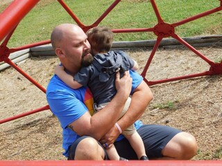 Obraz premium Father and son on a playground 