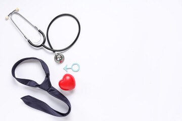 Stethoscope, tie, heart and male sign isolated on white background. Prostate cancer awareness