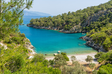 Obraz premium Pristine Bay Near Kayaköy, Turkey: Idyllic Mediterranean Beach with Turquoise Waters