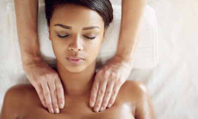 Woman, spa and massage for shoulder on bed, above and relax with physical therapy for muscle on vacation. Masseuse, girl and treatment for stress, fatigue and sleeping at wellness resort on holiday