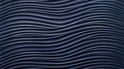Fine and delicate lines etched into a dark blue tread plate creating a wavelike pattern reminiscent of ocean waves