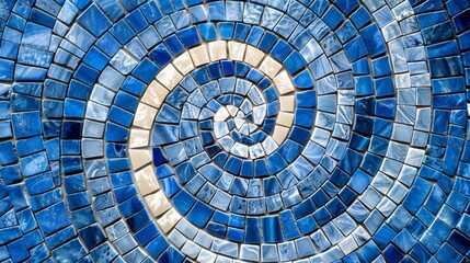 A textured closeup of glossy blue and white mosaic tiles creating a swirling hypnotizing effect as the tiles blend together in a stunning pattern