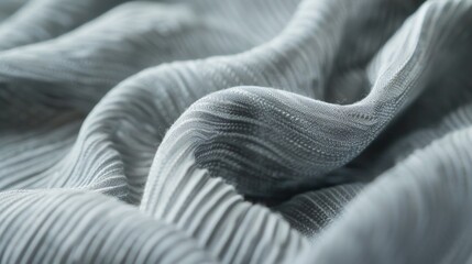 Soft and supple with a weighty d this light grey viscose fabric has a gentle ribbed texture thats both cozy and elegant