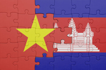 puzzle with the colourful national flag of vietnam and flag of cambodia .